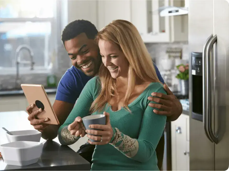 couple researching high-end appliance troubleshooting and repair options